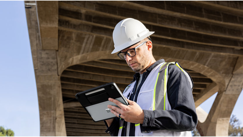 Frontline worker under bridge holding device